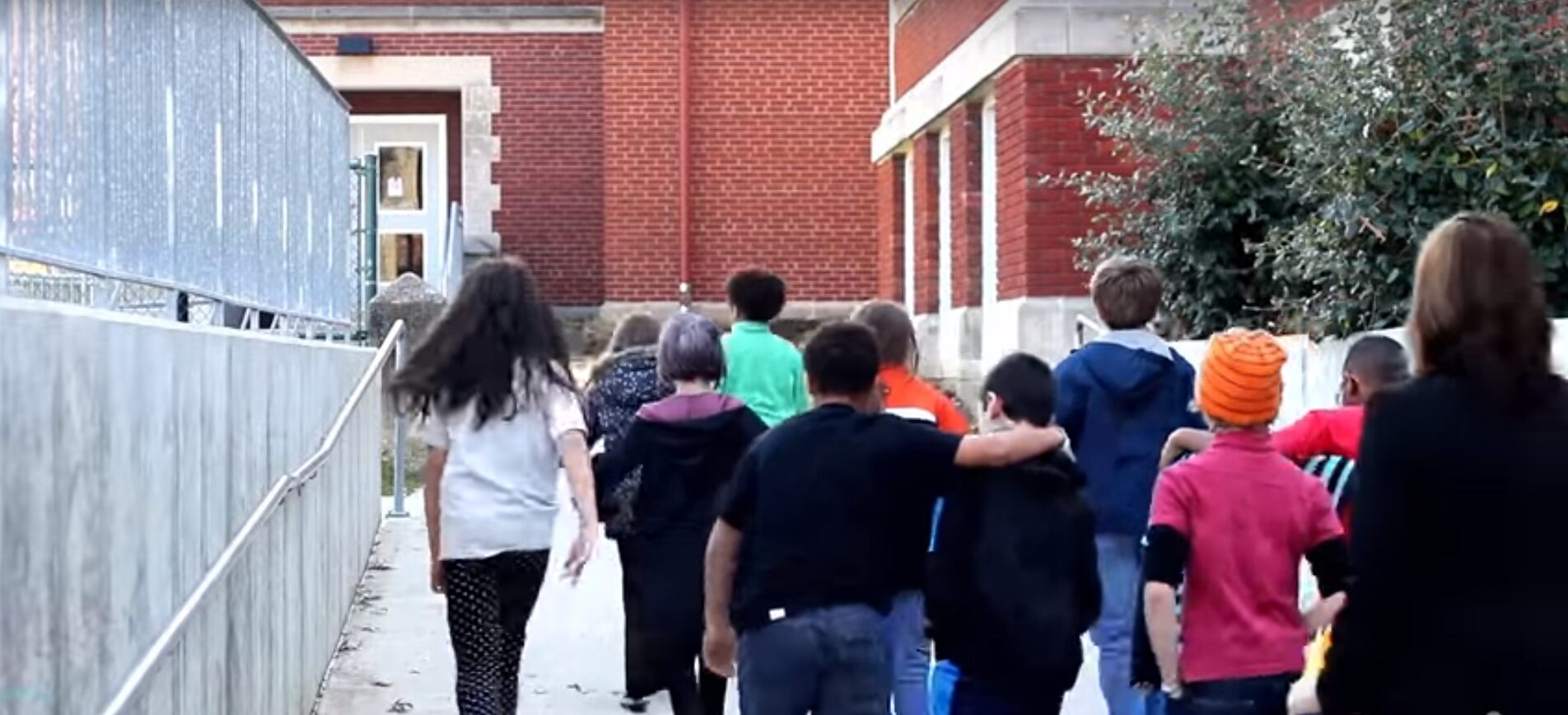children leaving school banner