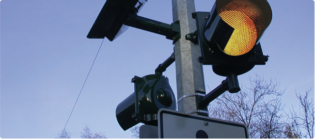 Detail of an R820 Solar LED Pedestrian Beacon on a light pole.