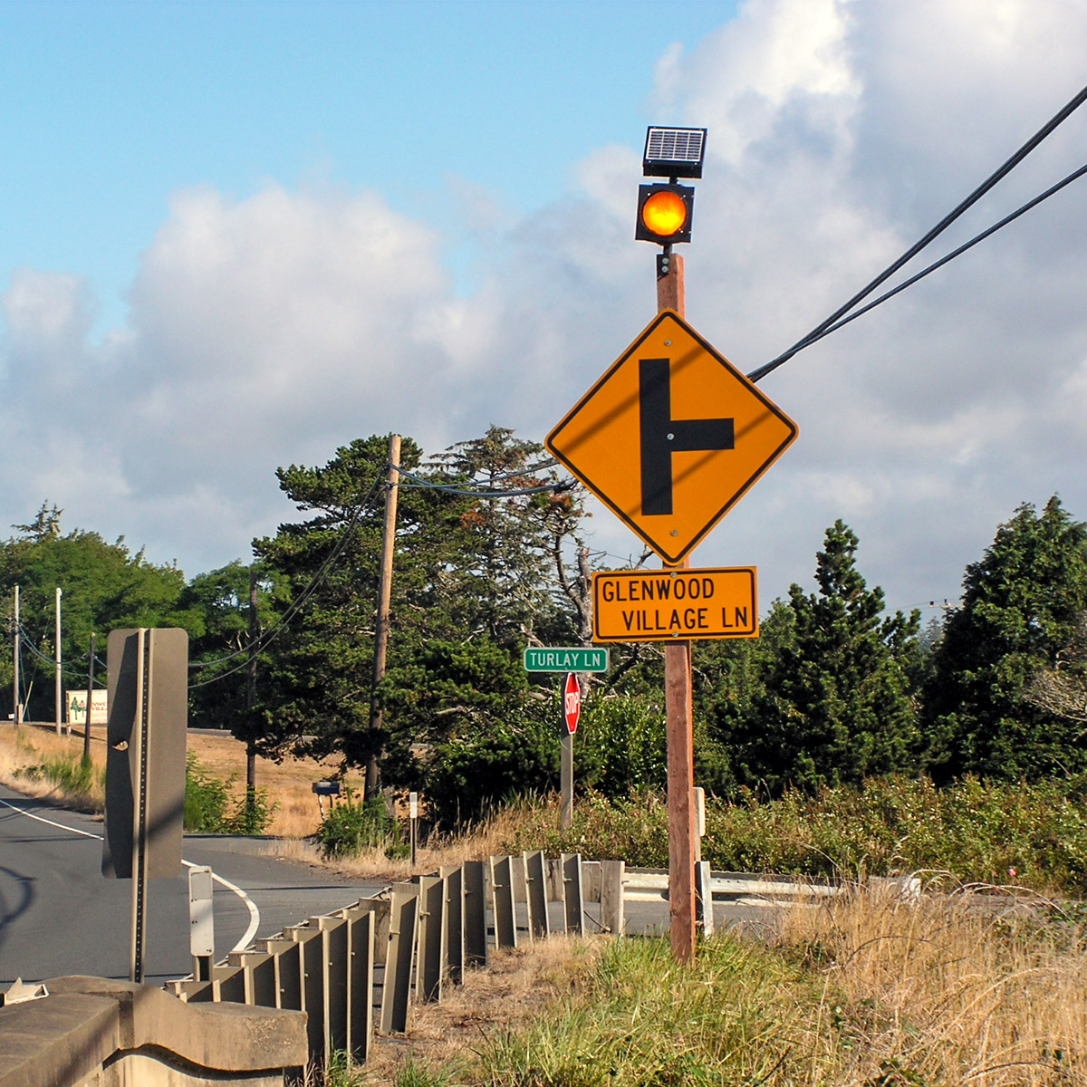solar-powered warning sign flashing beacon on sign
