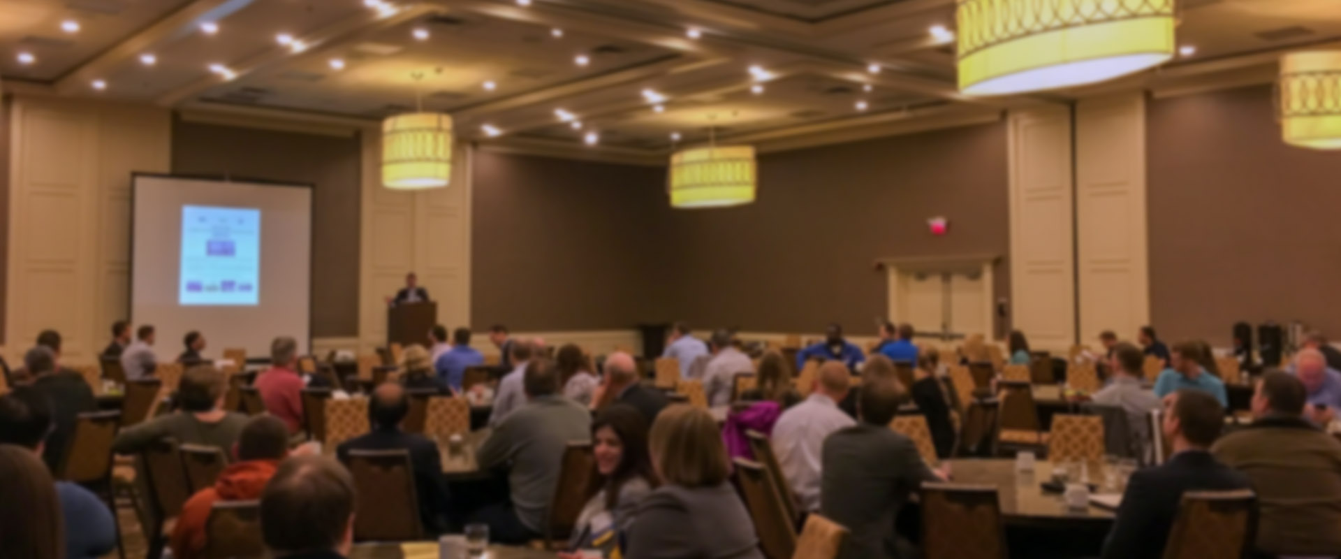 traffic trade show conference presentation with crowd and presenter