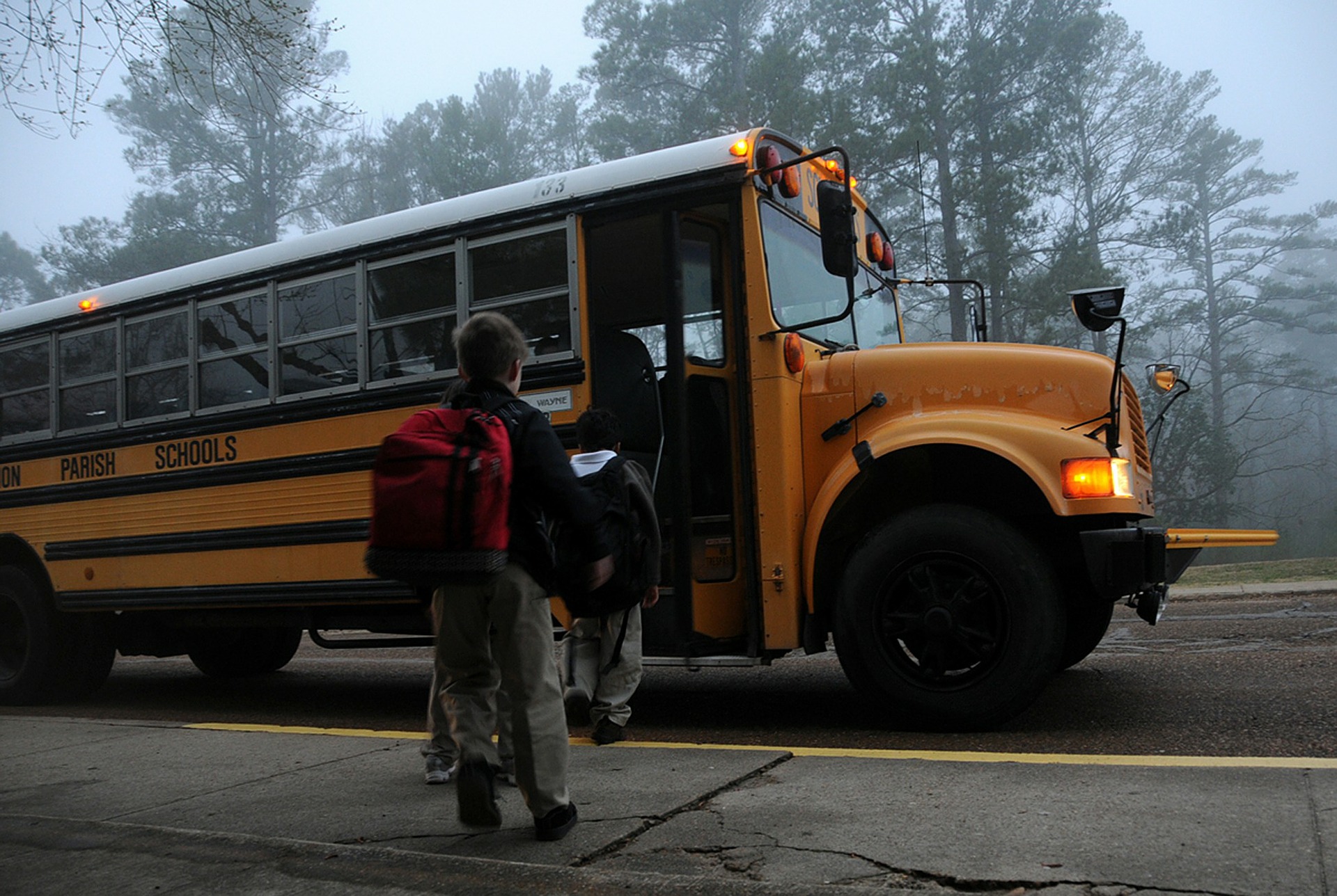 kids getting on a bus