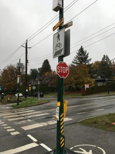 RRFB mounted on a crosswalk and stop sign in Vancouver